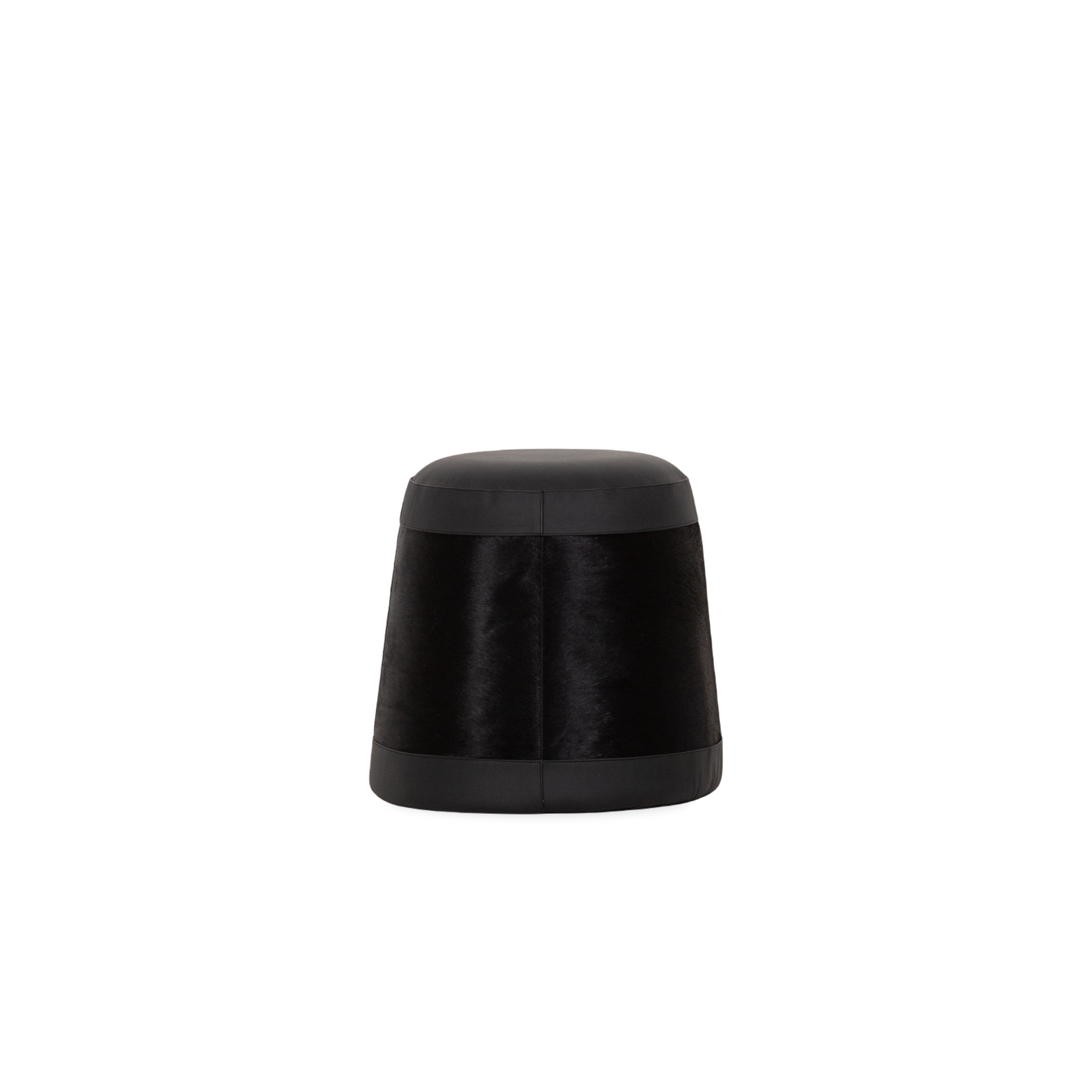 Handcrafted by artisans in India, the Hair-On-Hide Pouf is the perfect combination of form and function.