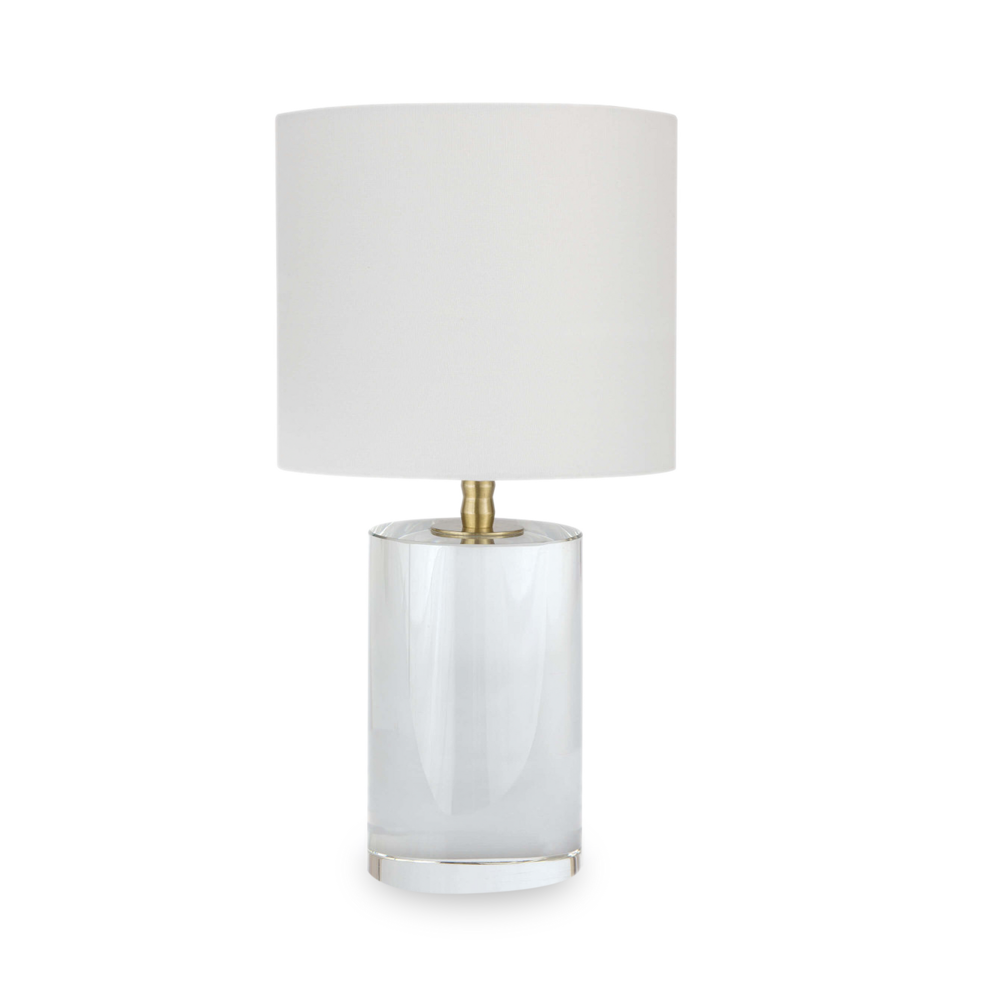 This solid crystal cylinder lamp base features a sleek silhouette and uniquely designed natural brass neck.