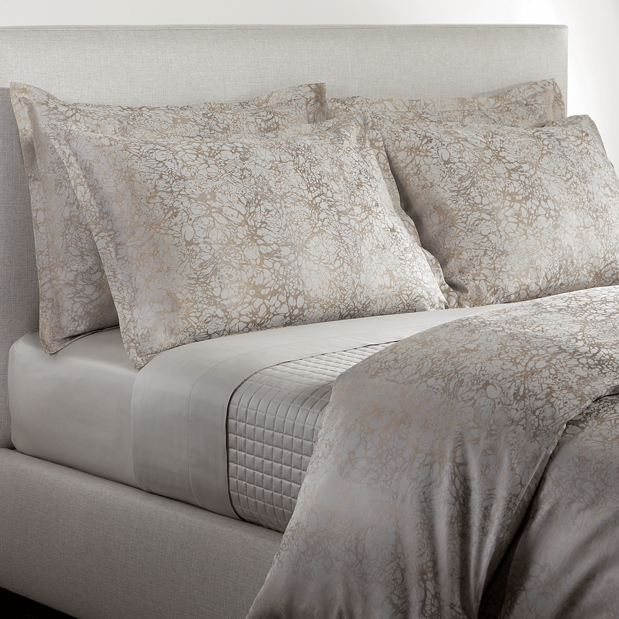 Produced in Italy exclusively for Elte, the Petal Collection's subtle floral motifs are blended in a neutral ivory palette, woven in a yarn dyed sateen jacquard.